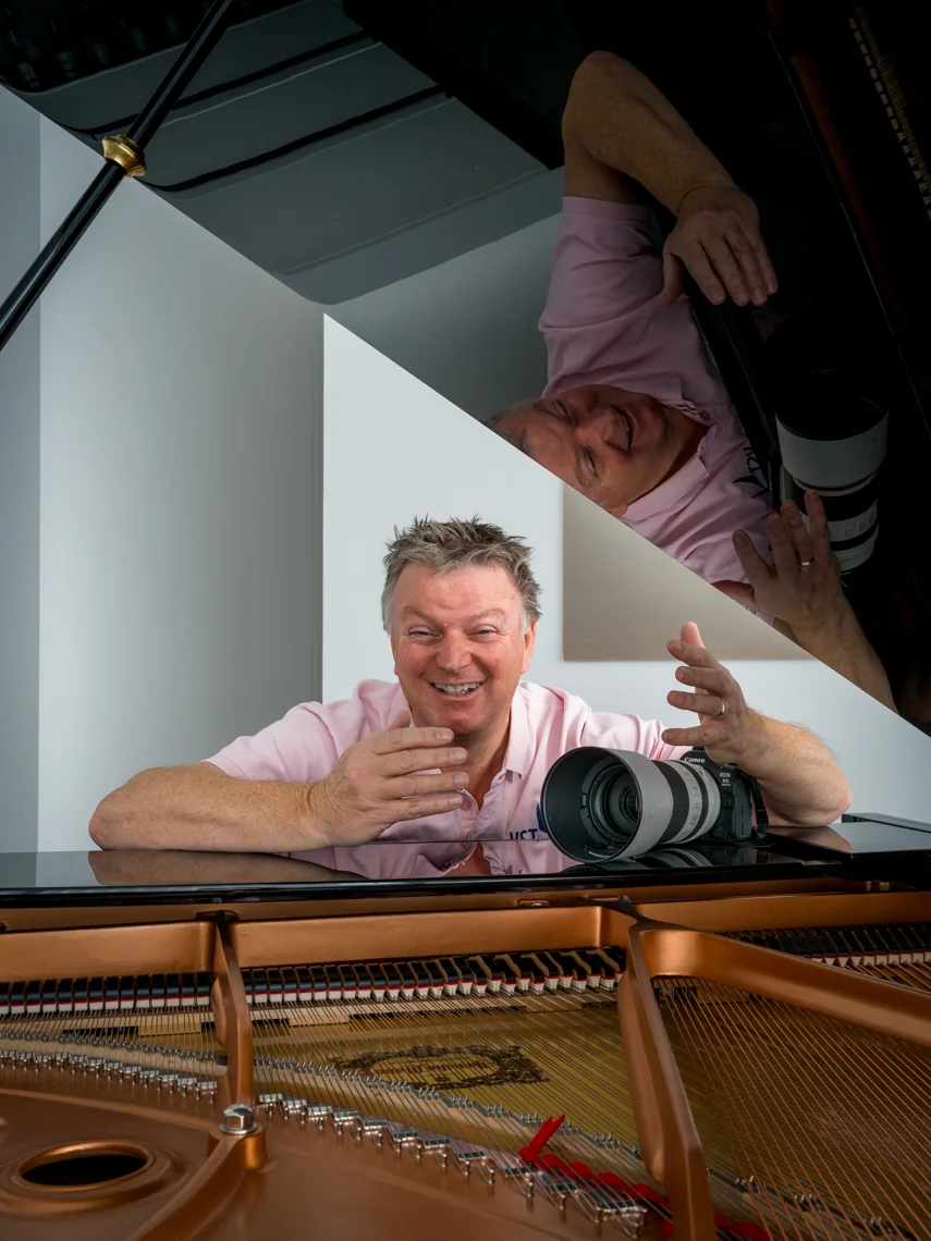 Ian Jones at the piano, camera in hand